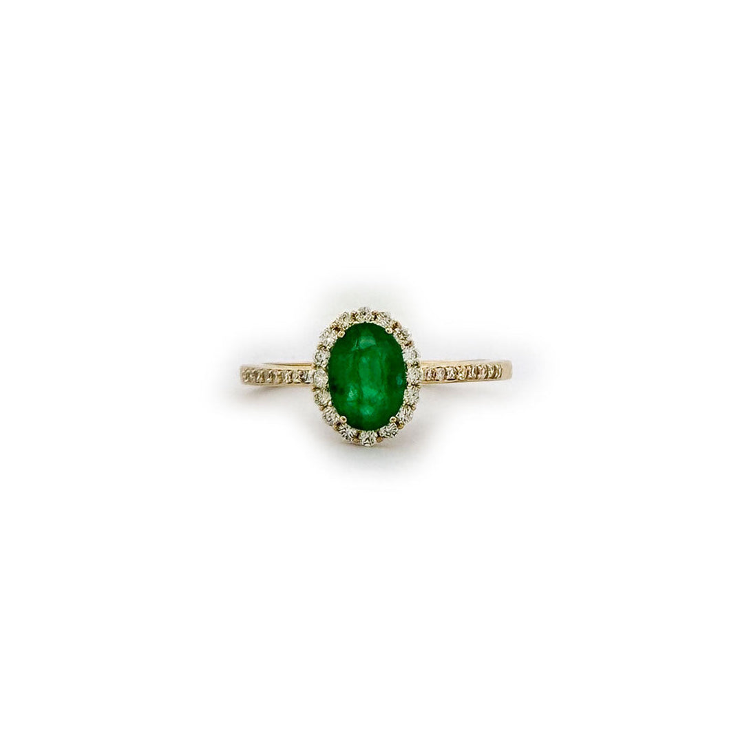 Anillo amarillo 10K con esmeralda ovalada y halo de diamantes 0.25ctw
