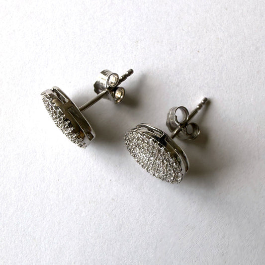 Aretes en plata ovalados con diamantes 0.25ctw