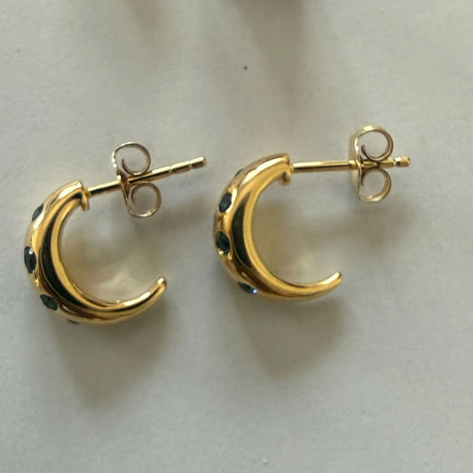Aretes en plata con baño de oro y topacio london blue incrustados