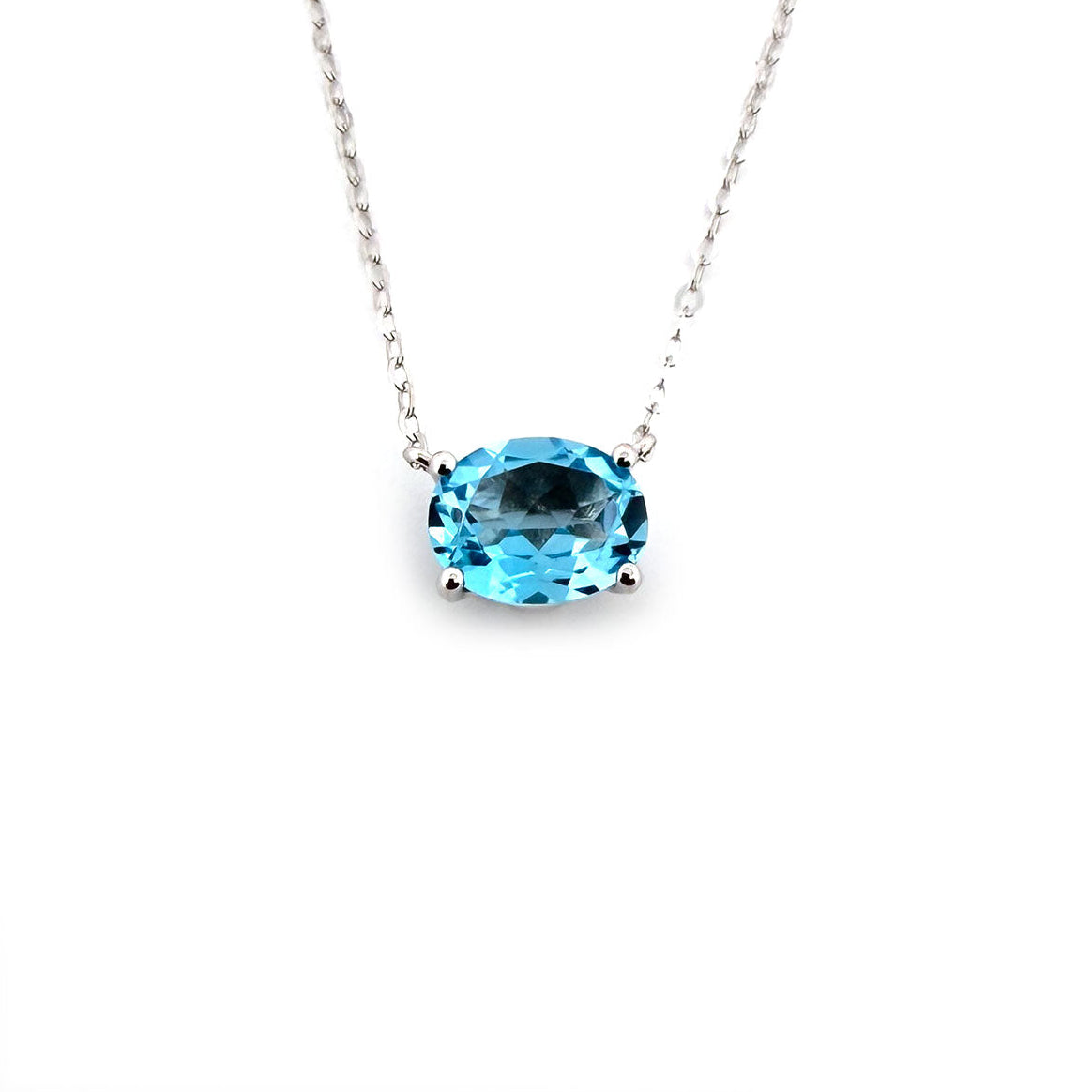 Collar en oro blanco 10k con topacio azul ovalado