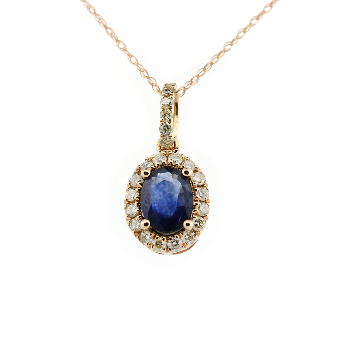 Collar en oro amarillo 10K con dije de zafiro ovalado con halo y pasa cadenas de diamantes 0.30ctw