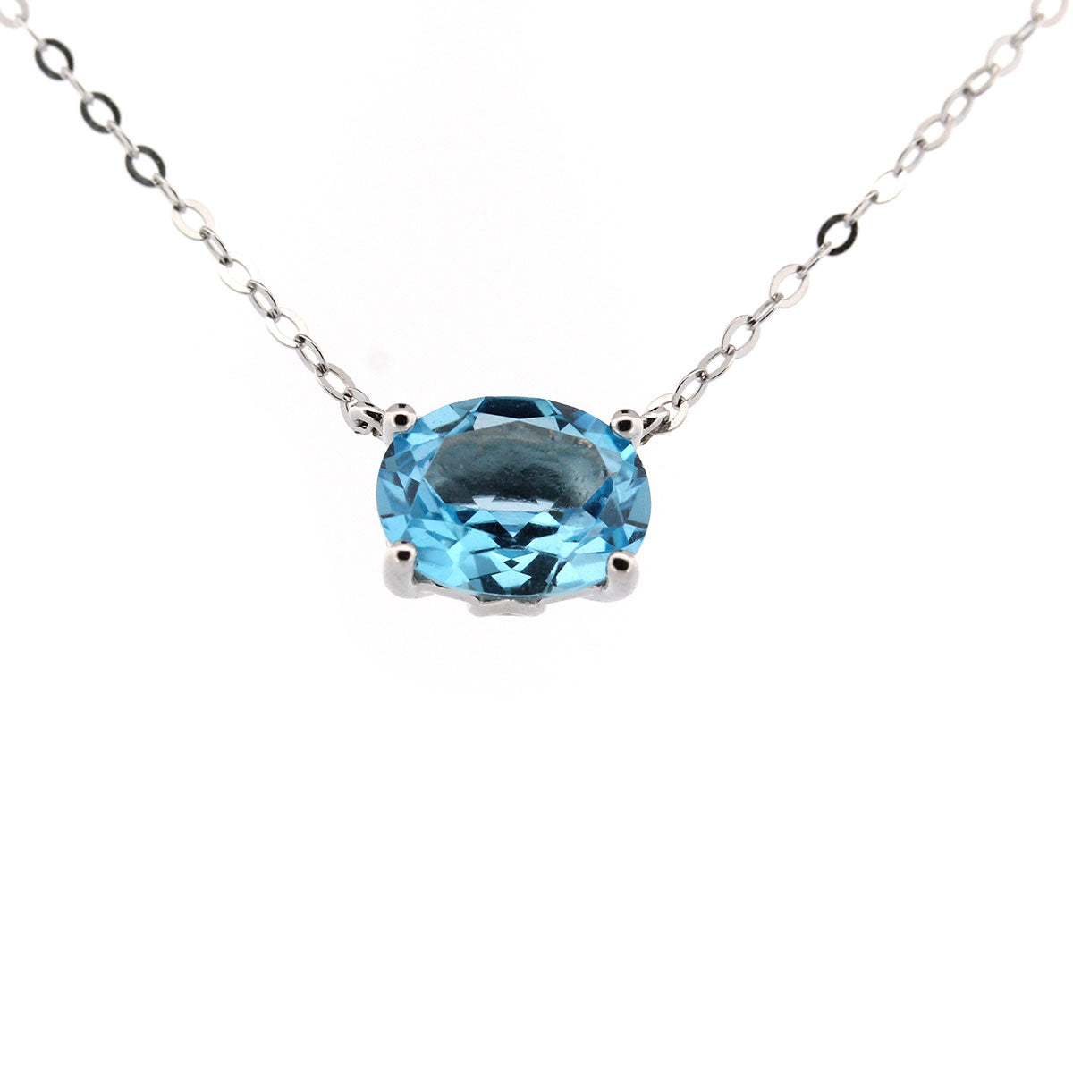 Collar en oro blanco 10k con topacio azul ovalado