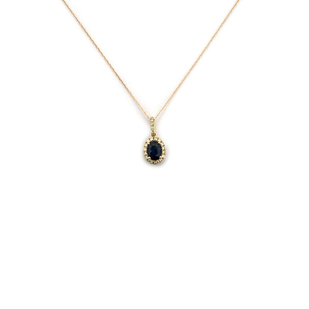 Collar en oro amarillo 10K con dije de zafiro ovalado con halo y pasa cadenas de diamantes 0.30ctw