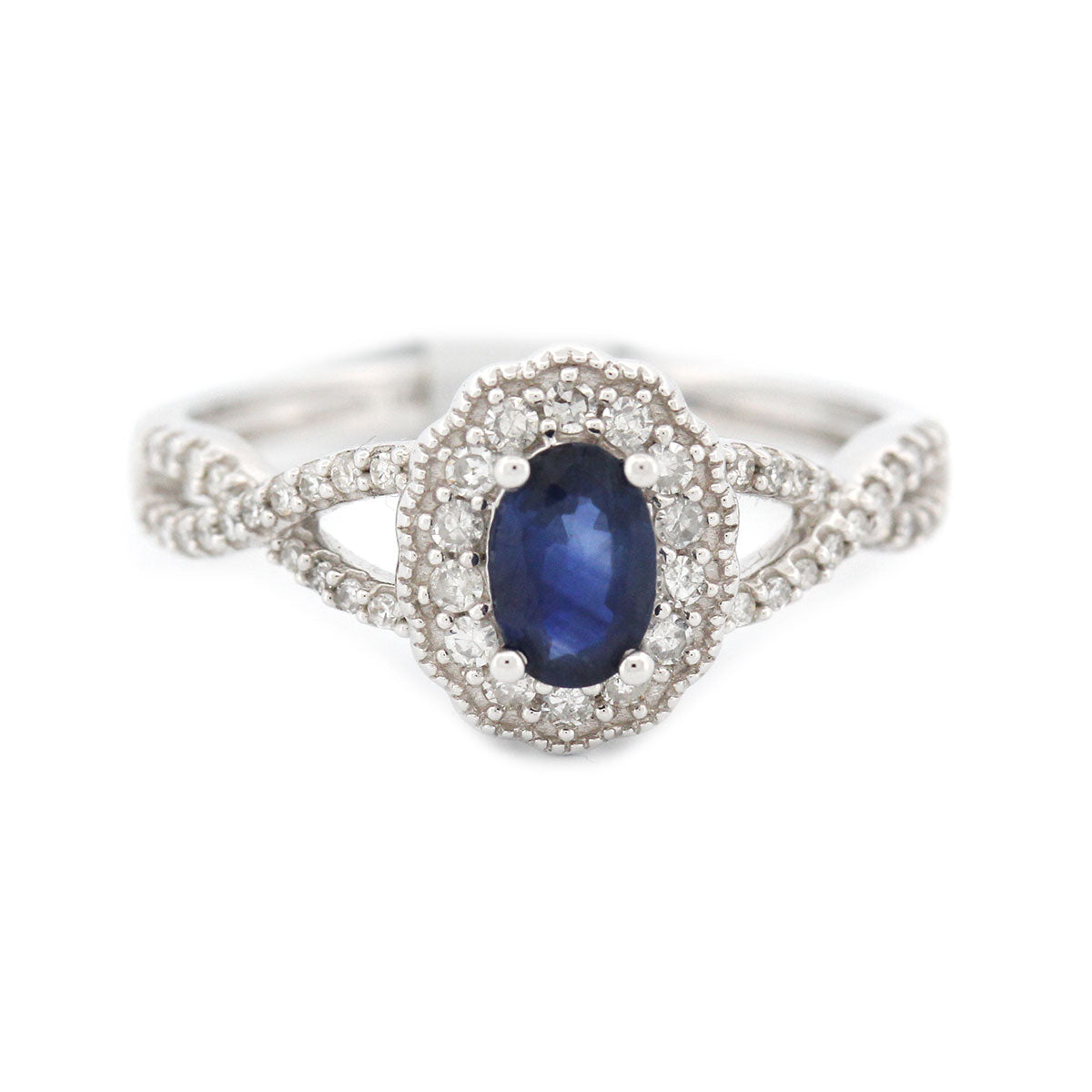 Anillo en oro blanco 14K con zafiro ovalado y diamantes 0.25ctw