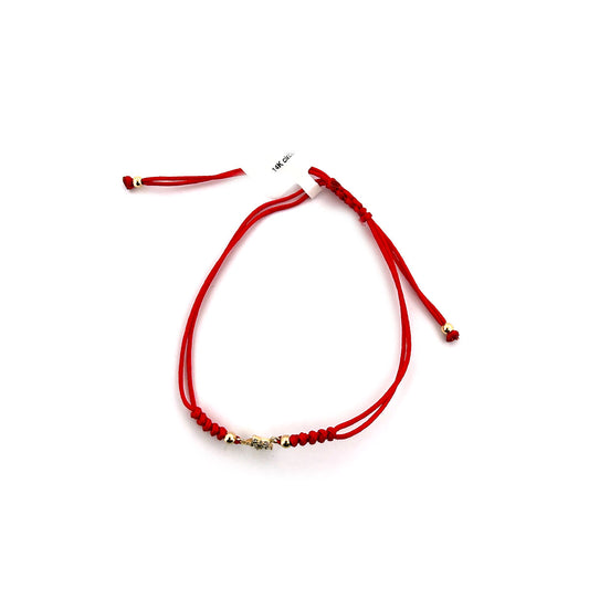 Pulsera de cordón rojo con estrella delineada pequeña de circonitas en oro amarillo 14K