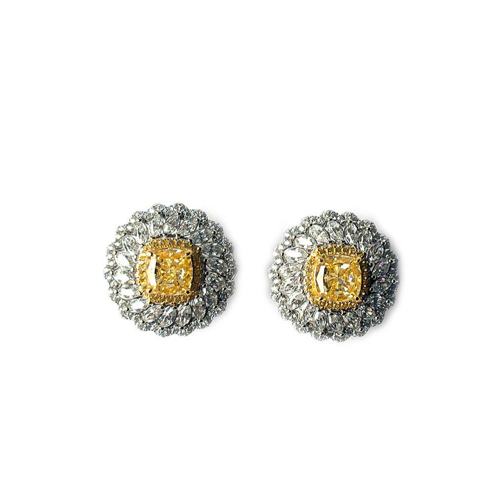 Aretes girasol con circones blancos y amarillos en plata con baño de platino