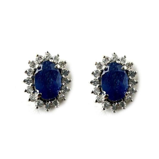 Aretes de oro blanco 14k con zafiros ovalados 1.25ctw y halo de diamantes 0.23ctw