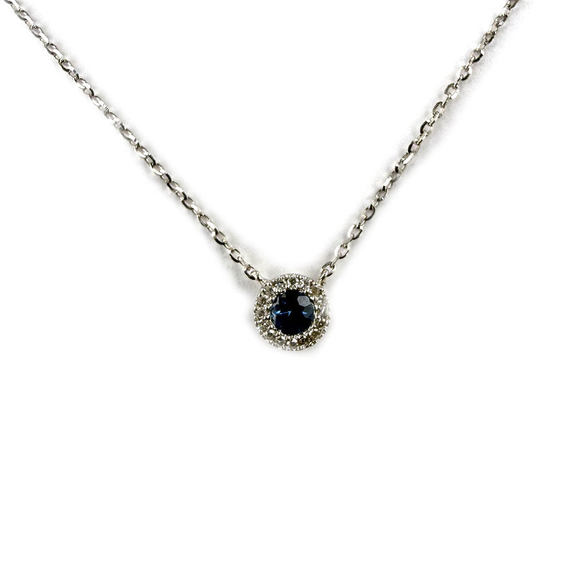 Collar en oro blanco 14k con zafiro redondo 0.13ct y halo de diamantes 0.04ctw