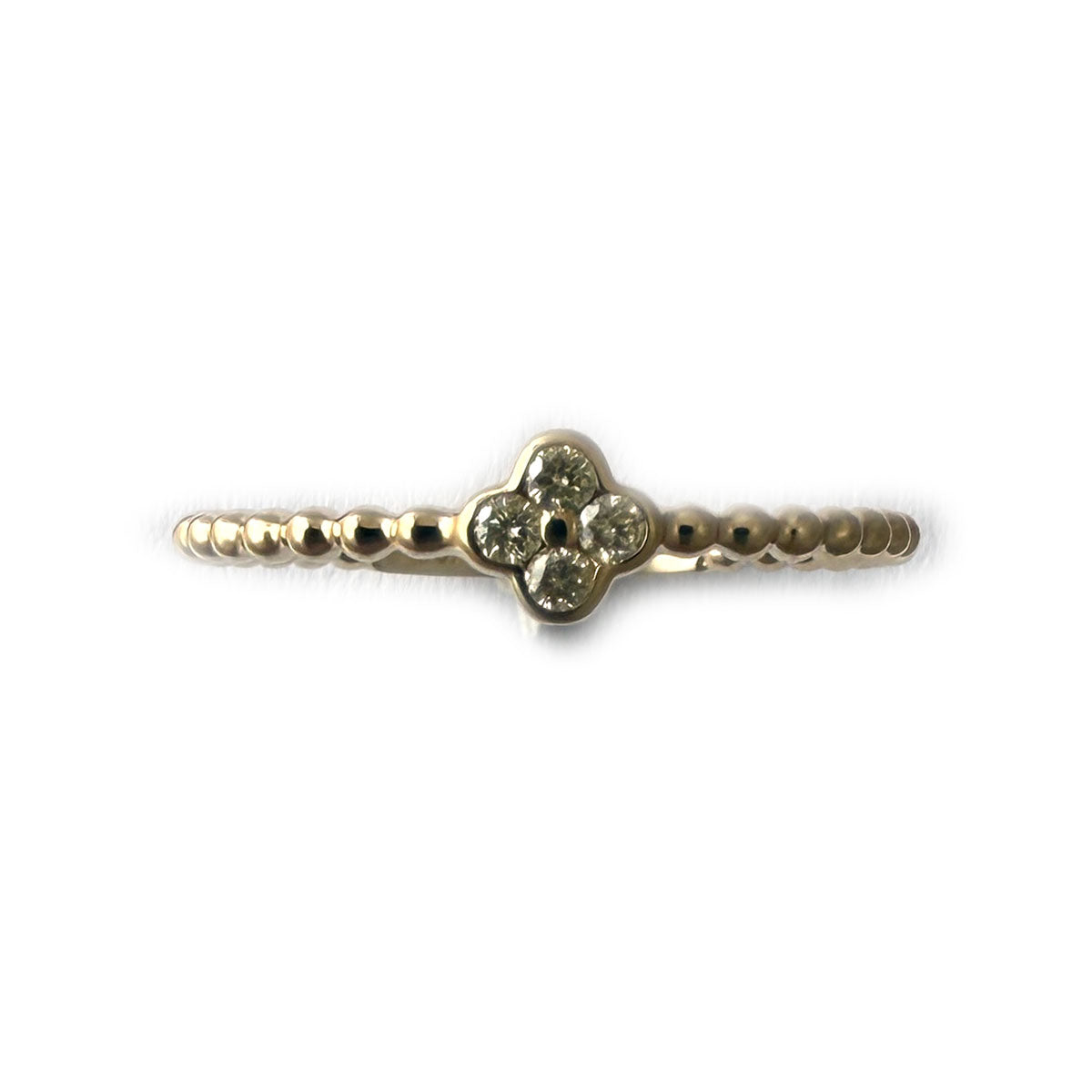 Anillo en oro amarillo 10k de bolitas con mini flor de diamantes 0.10ctw
