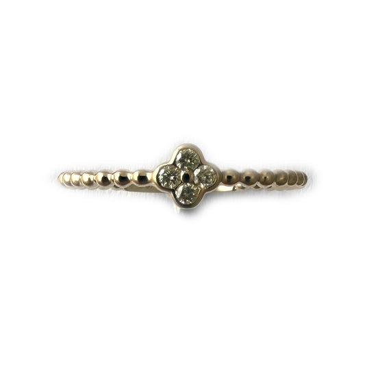 Anillo en oro amarillo 10k de bolitas con mini flor de diamantes 0.10ctw