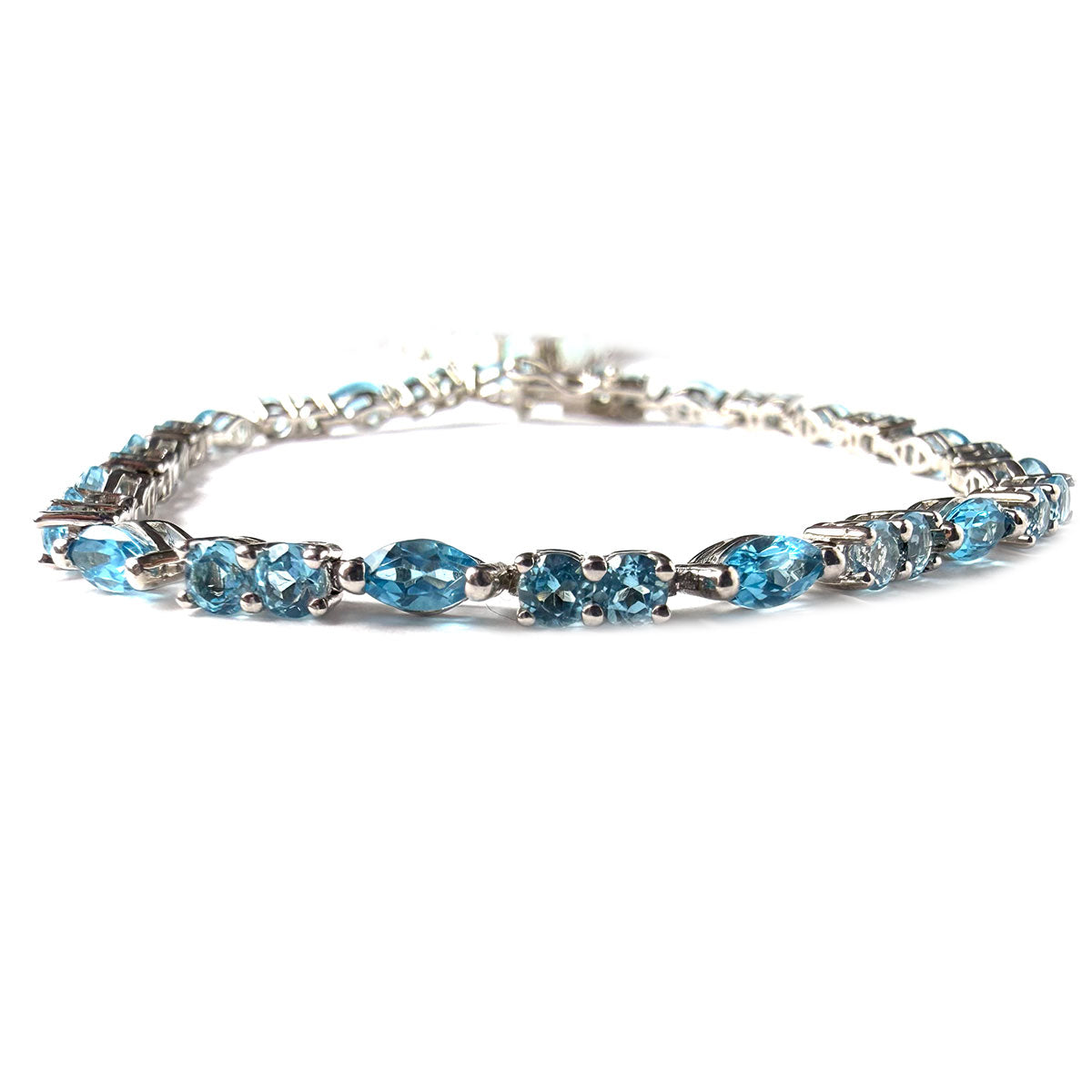 Pulsera de plata con topacios azules redondos y marquesa