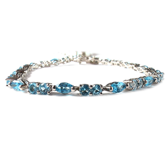 Pulsera de plata con topacios azules redondos y marquesa