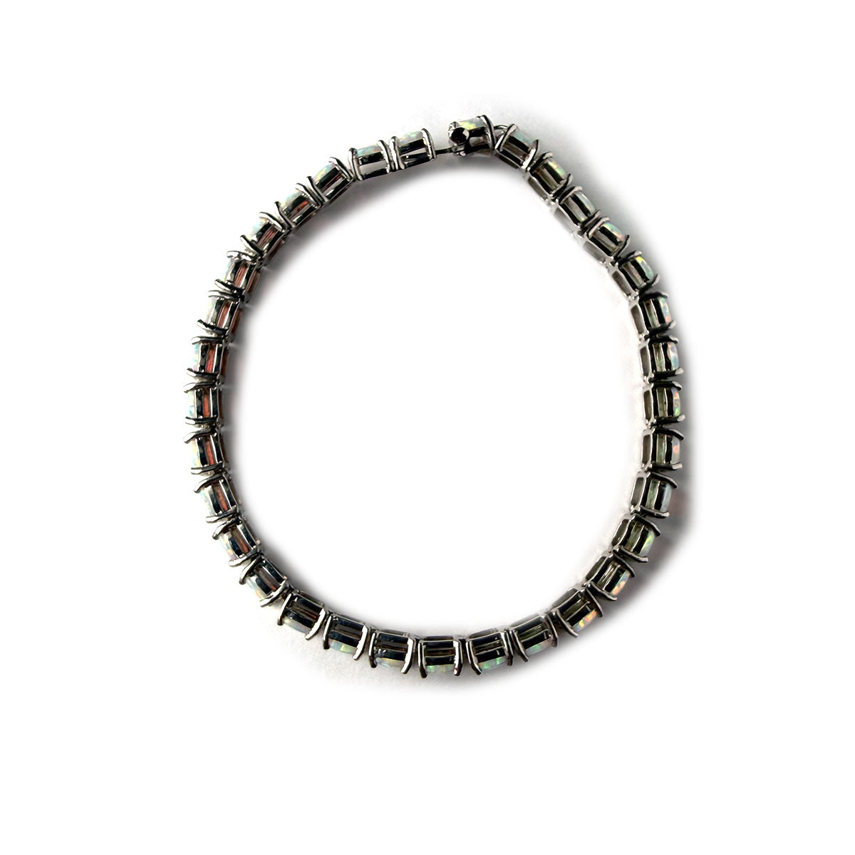 Pulsera de plata con topacios azules redondos y marquesa