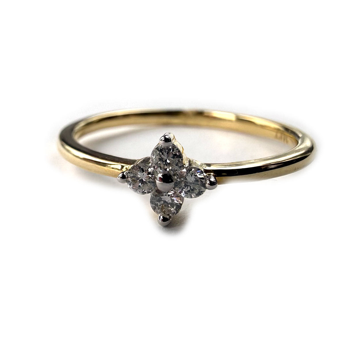Anillo en oro amarillo 14K con florcita de cuatro diamantes 0.11ctw