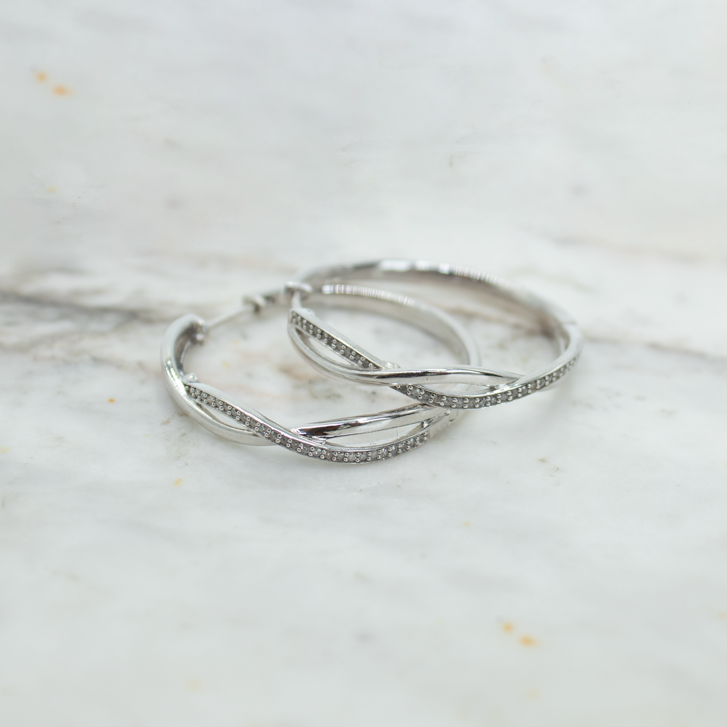 Sterling silver and diamond knot hoops 0.25ctw