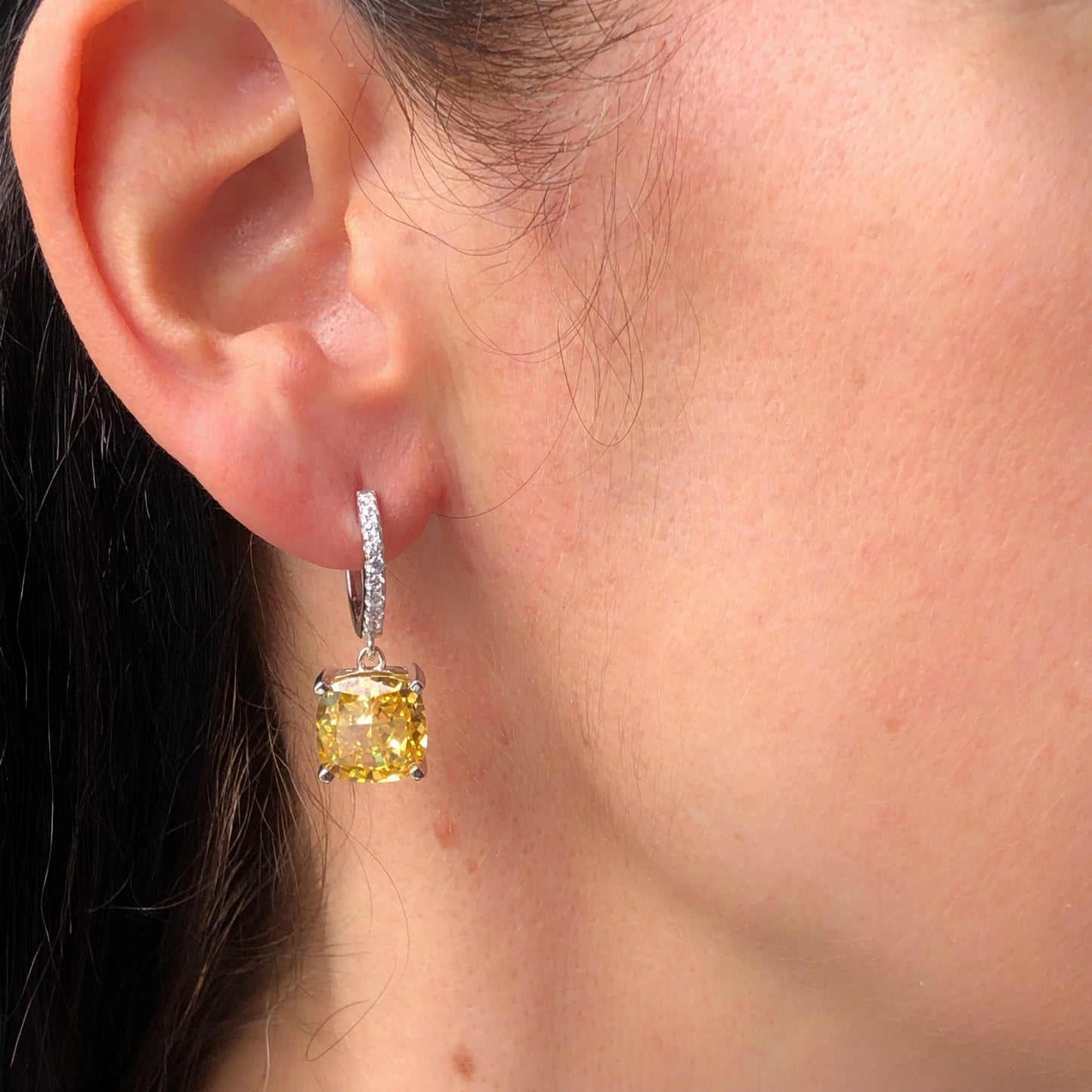 Sterling Silver Huggie hoops with dangling yellow zircon